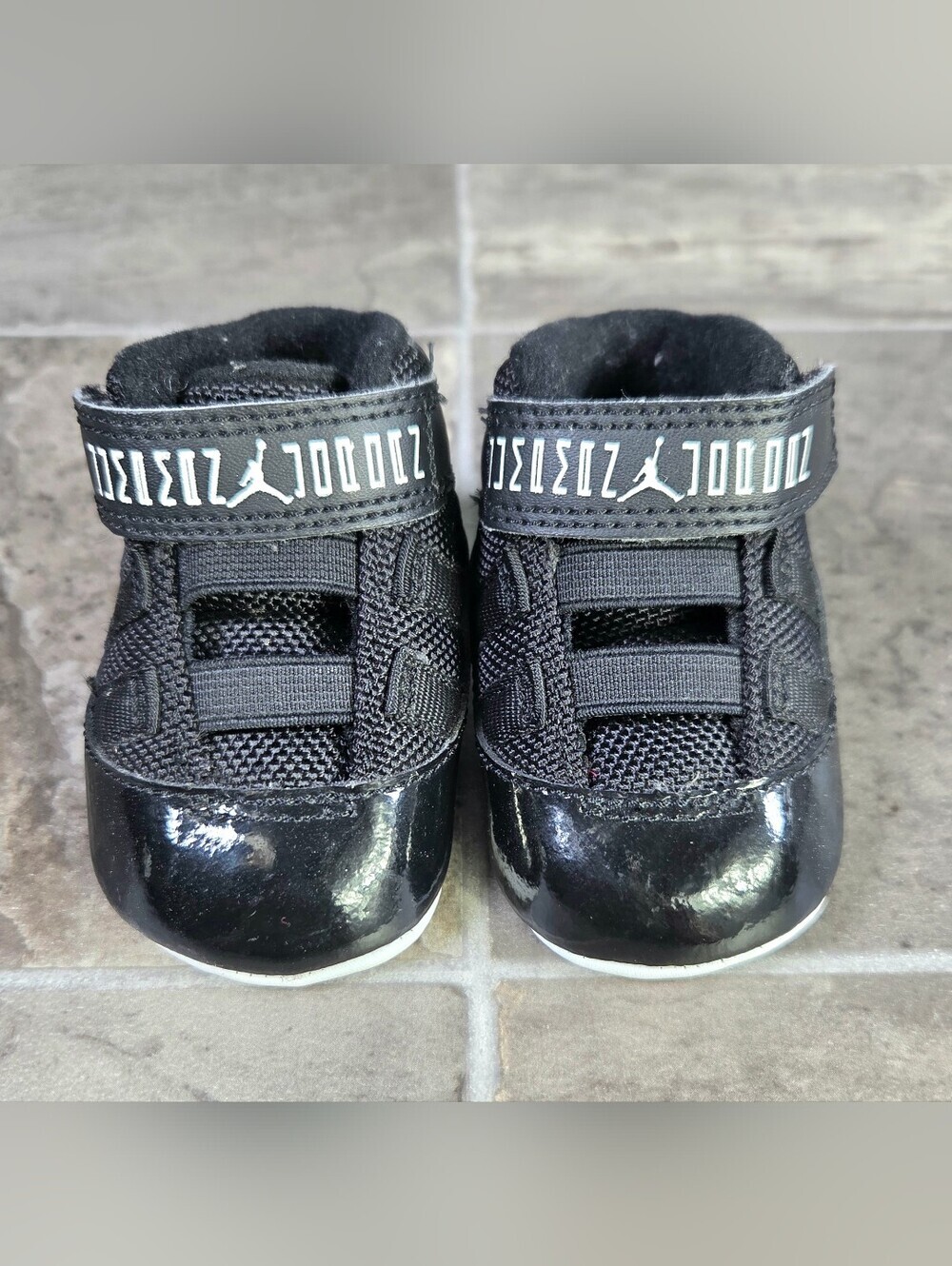 AIR JORDAN 11 RETRO "BRED" CRIB BOOTIE SNEAKERS.